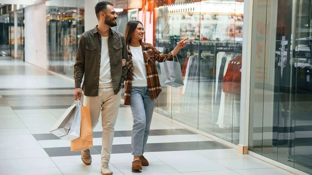 Happy Couple Enjoying Shopping in the Mall